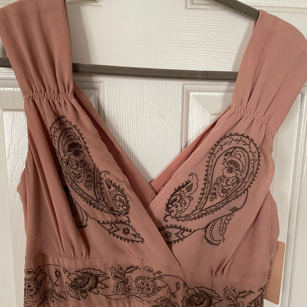 This is a peach colored dress, perfect for Spring and Summer.